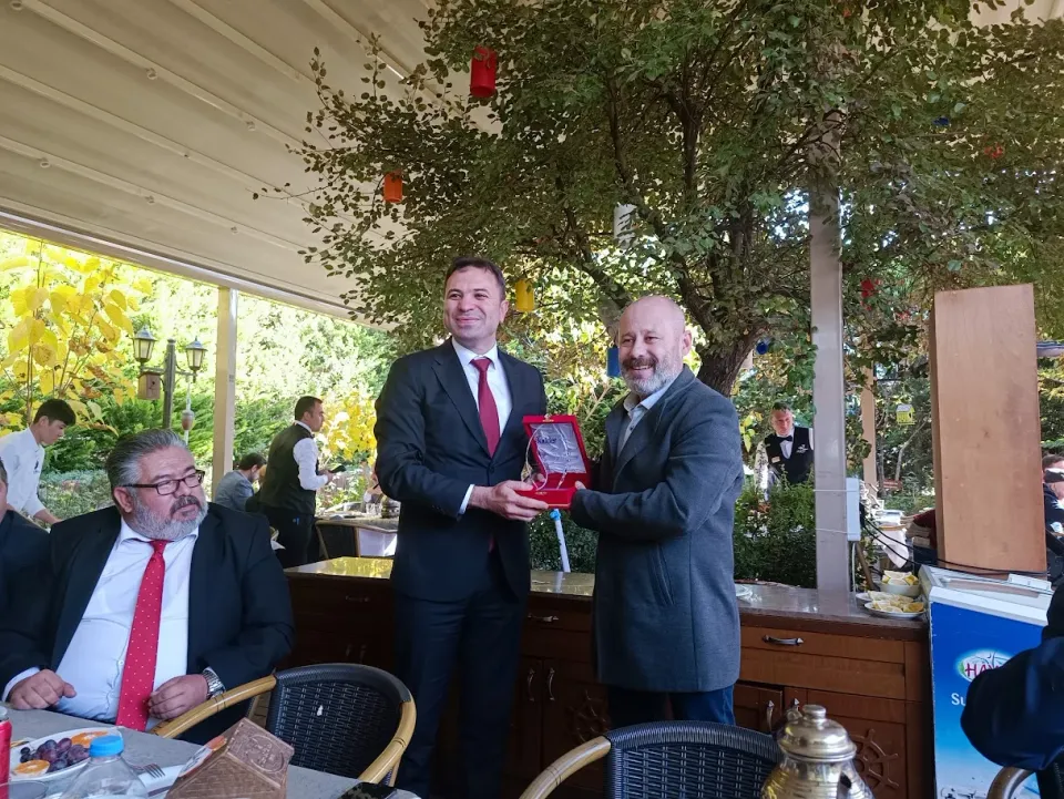 A plaque presentation in a bright, open setting